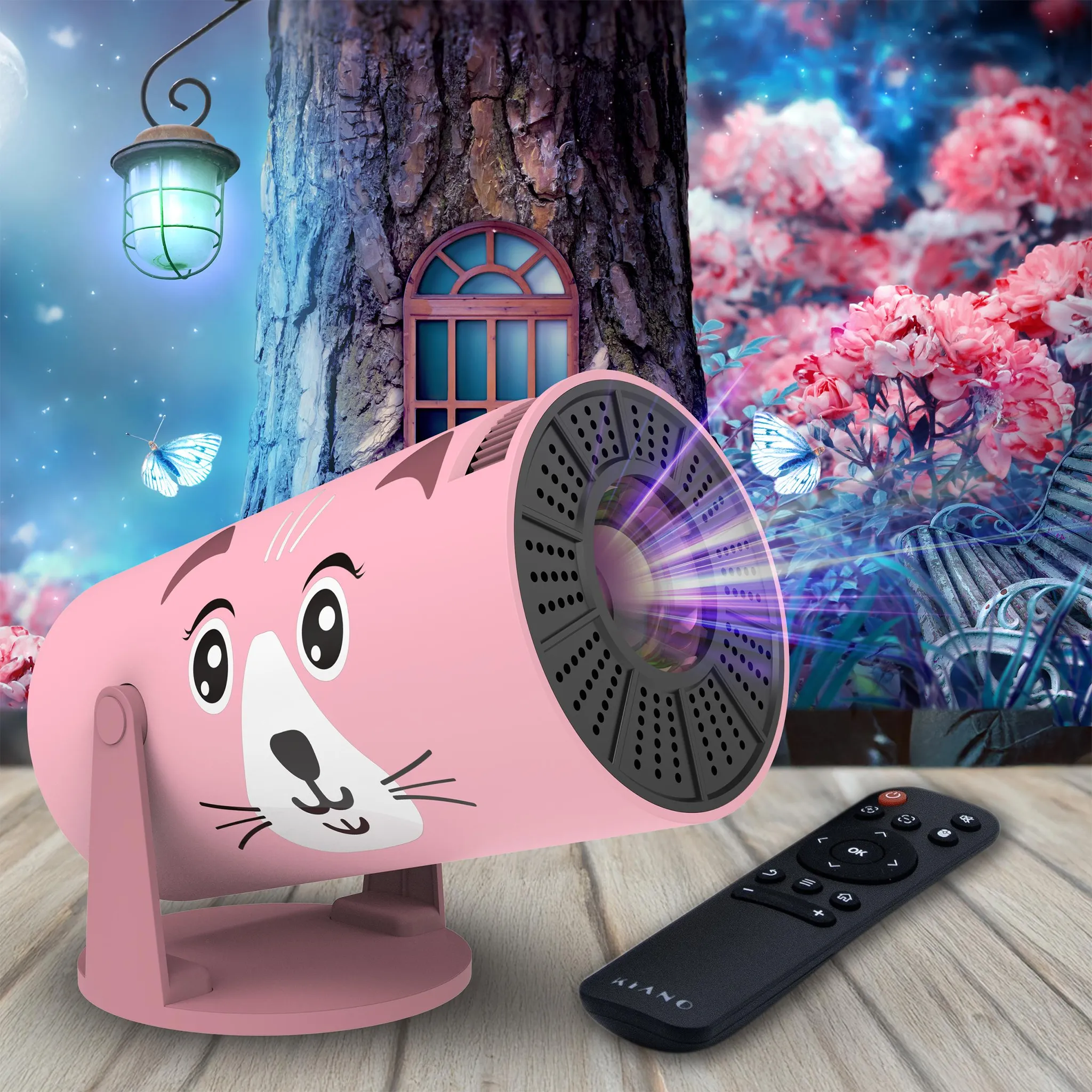 Ein rosa Katzenprojektor mit Fernbedienung steht vor einem Baumhaus mit Blumen.