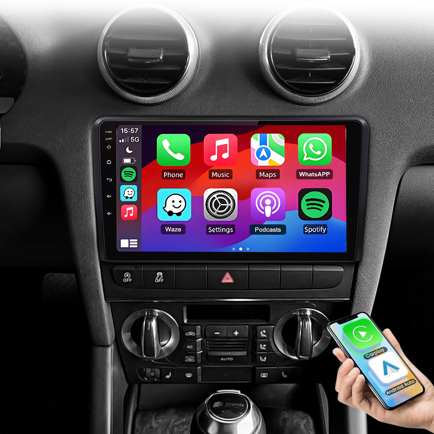 Deska rozdzielcza z ekranem multimediów pokazującym aplikacje. Telefon w dłoni w pobliżu.