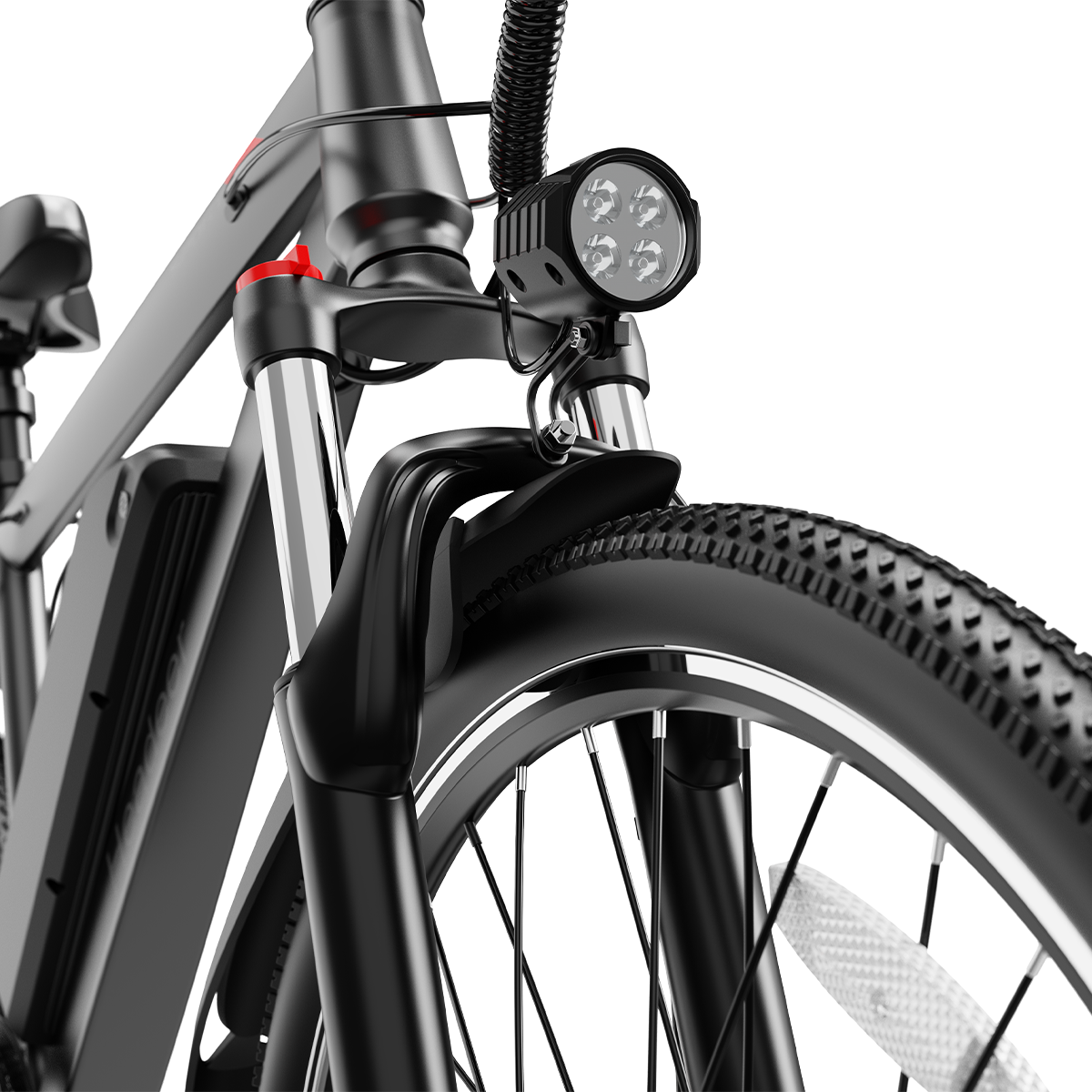 Przód czarnego roweru elektrycznego z reflektorem, amortyzatorem i oponą.