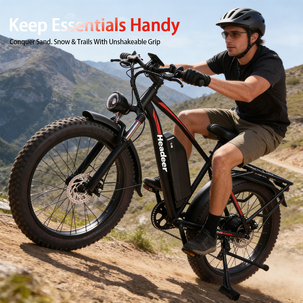 Mężczyzna jedzie czarnym rowerem elektrycznym po kamienistym szlaku.