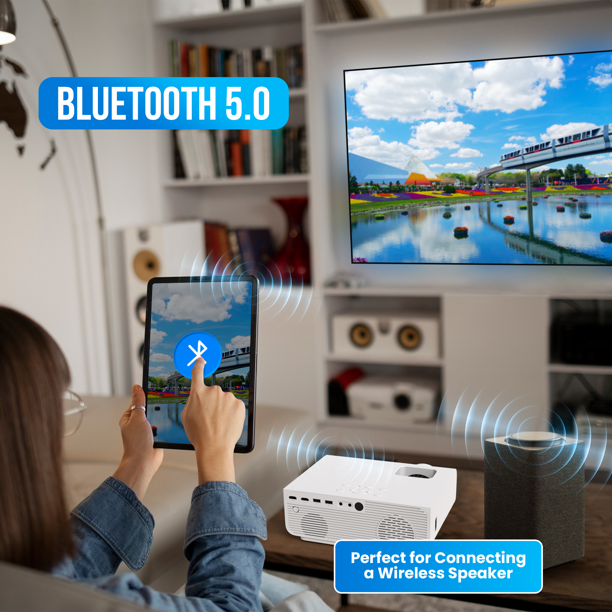 Une personne utilise une tablette pour connecter un projecteur à un haut-parleur.