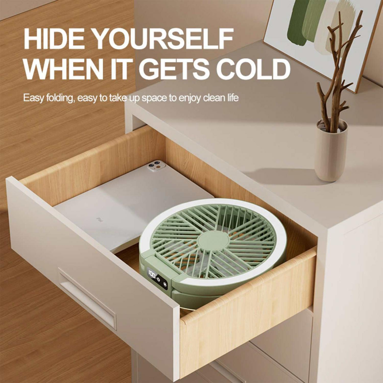 Ein grüner Ventilator und ein Tablet liegen in einer Schublade.