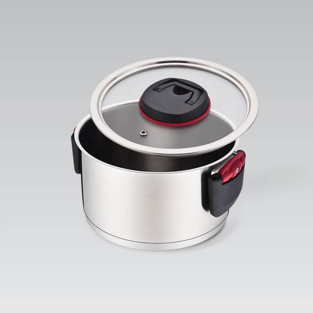 Stalowy garnek ze szklaną pokrywą i czarnymi uchwytami z czerwonymi akcentami.