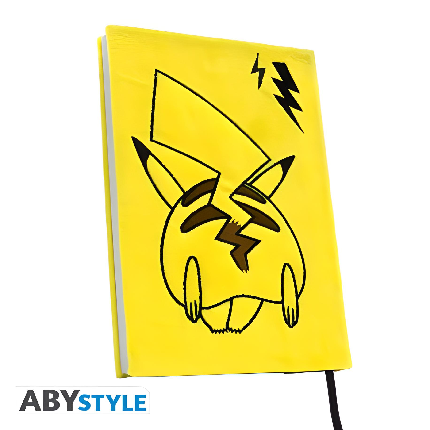 Gelbes Notizbuch mit Pikachu-Motiv und Blitzen.