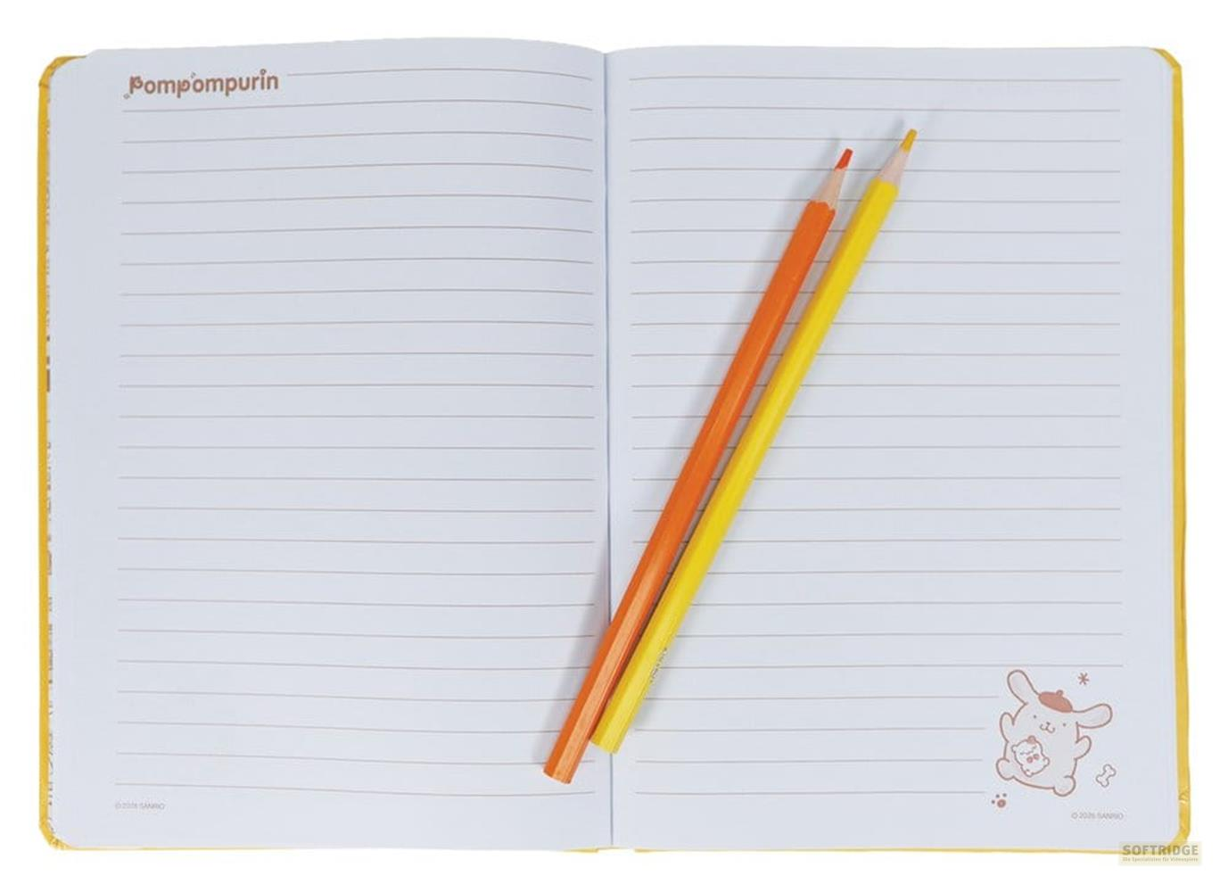 Ein aufgeschlagenes Notizbuch mit linierten Seiten und zwei Buntstiften.