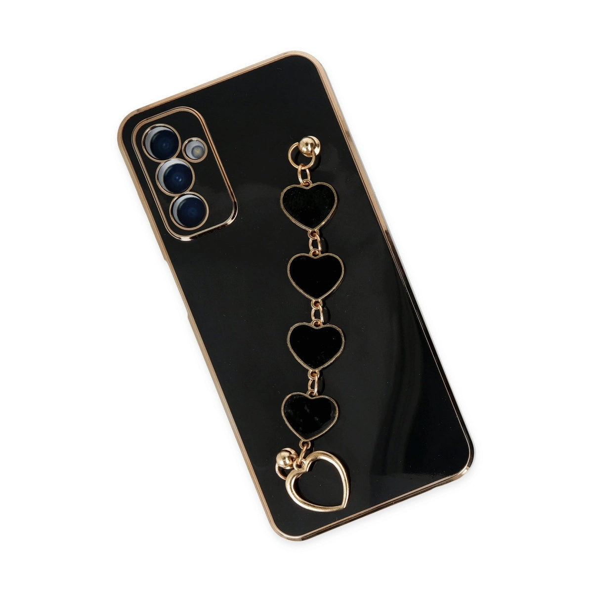 Kalp şeklinde charm ve altın kenarlı siyah telefon kılıfı.