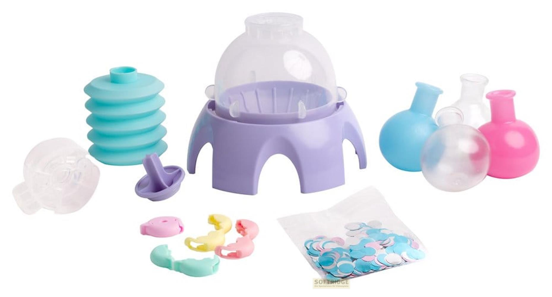 Ein Set mit bunten Plastikwerkzeugen und Konfetti auf weißem Hintergrund.