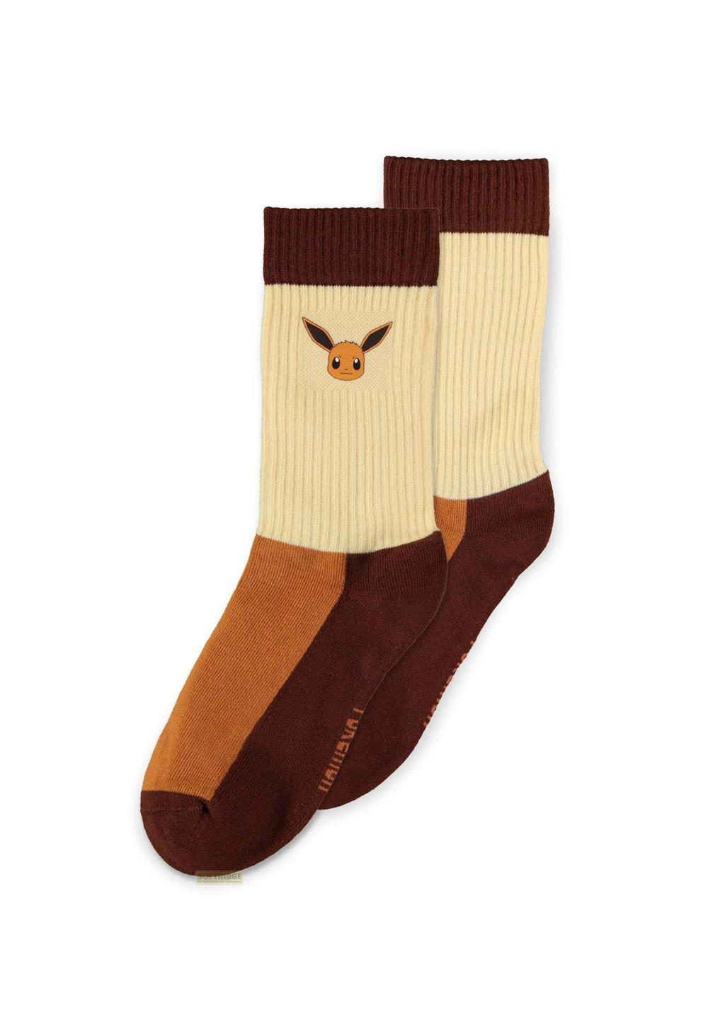 Dos calcetines con Eevee, en bloques de color beige, marrón y naranja.