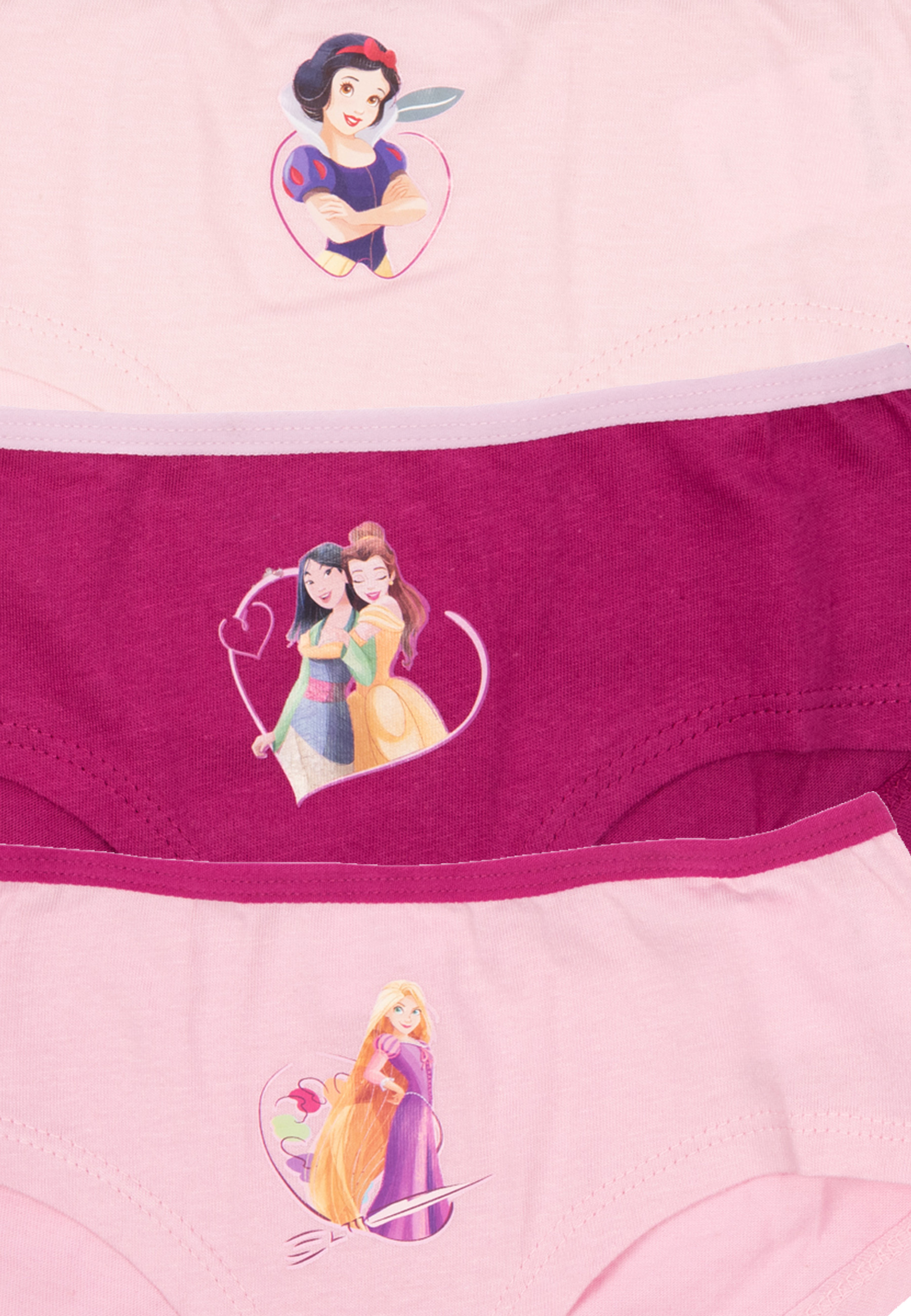 Drei Höschen mit Disney-Prinzessinnen-Aufdrucken auf rosa und pinkfarbenem Stoff.