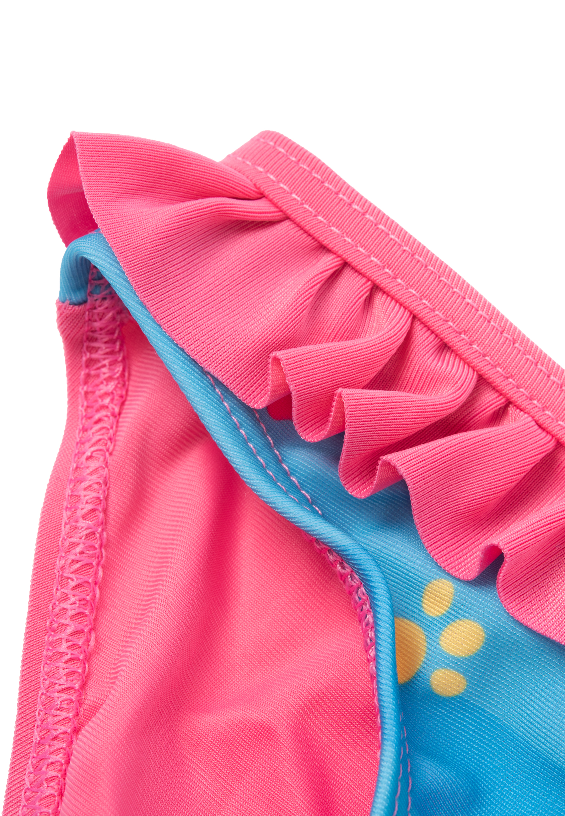 Nahaufnahme eines rosa Badeanzugs mit blauen Akzenten und gelben Punkten.