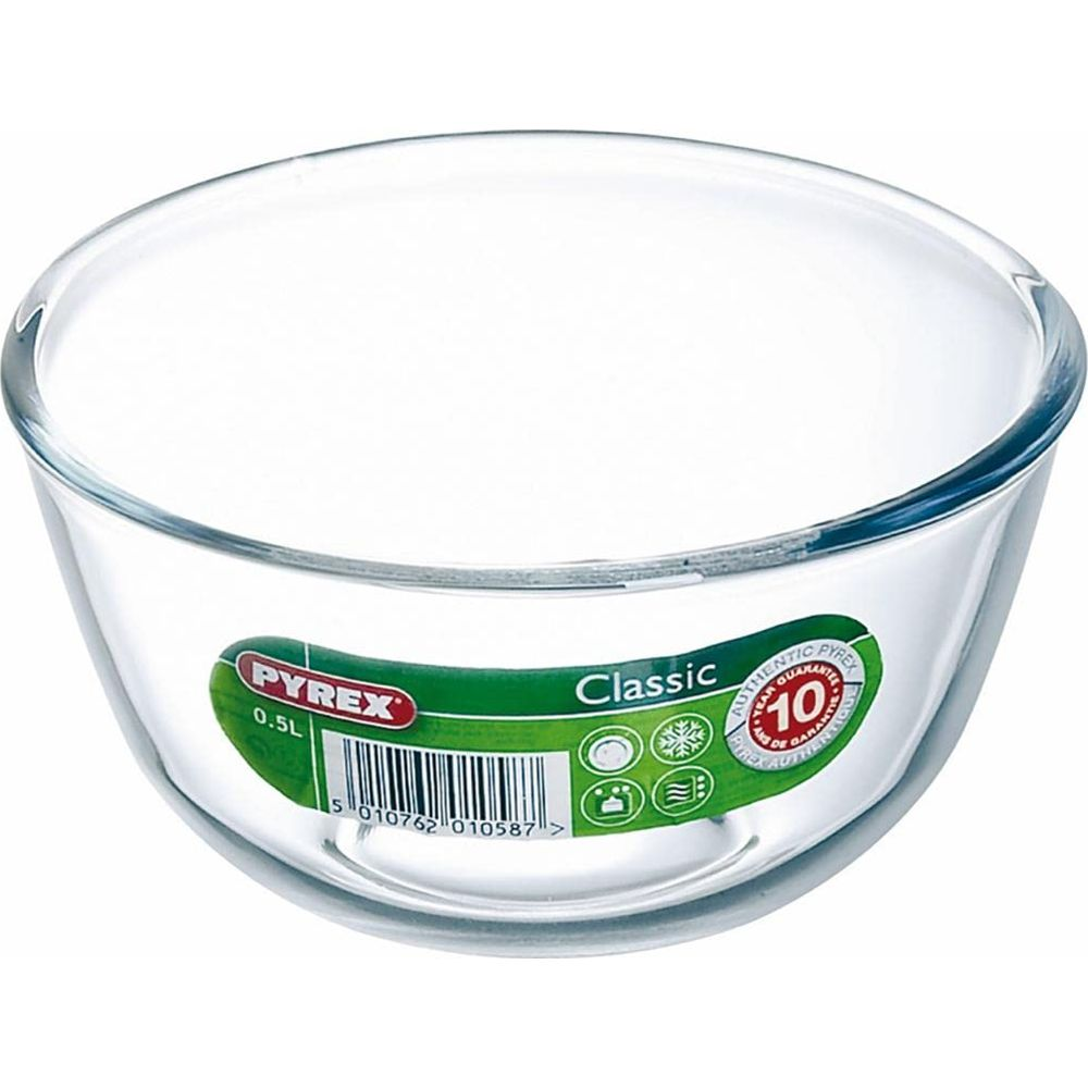 Eine durchsichtige Pyrex-Glasschüssel mit einem grünen Etikett.