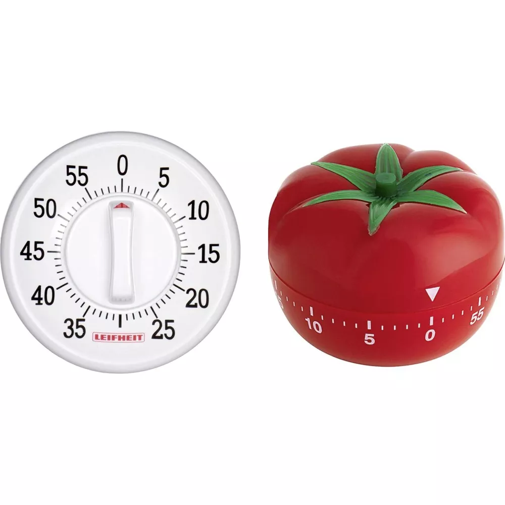 Ein weißer und ein roter Tomaten-Küchenwecker nebeneinander.