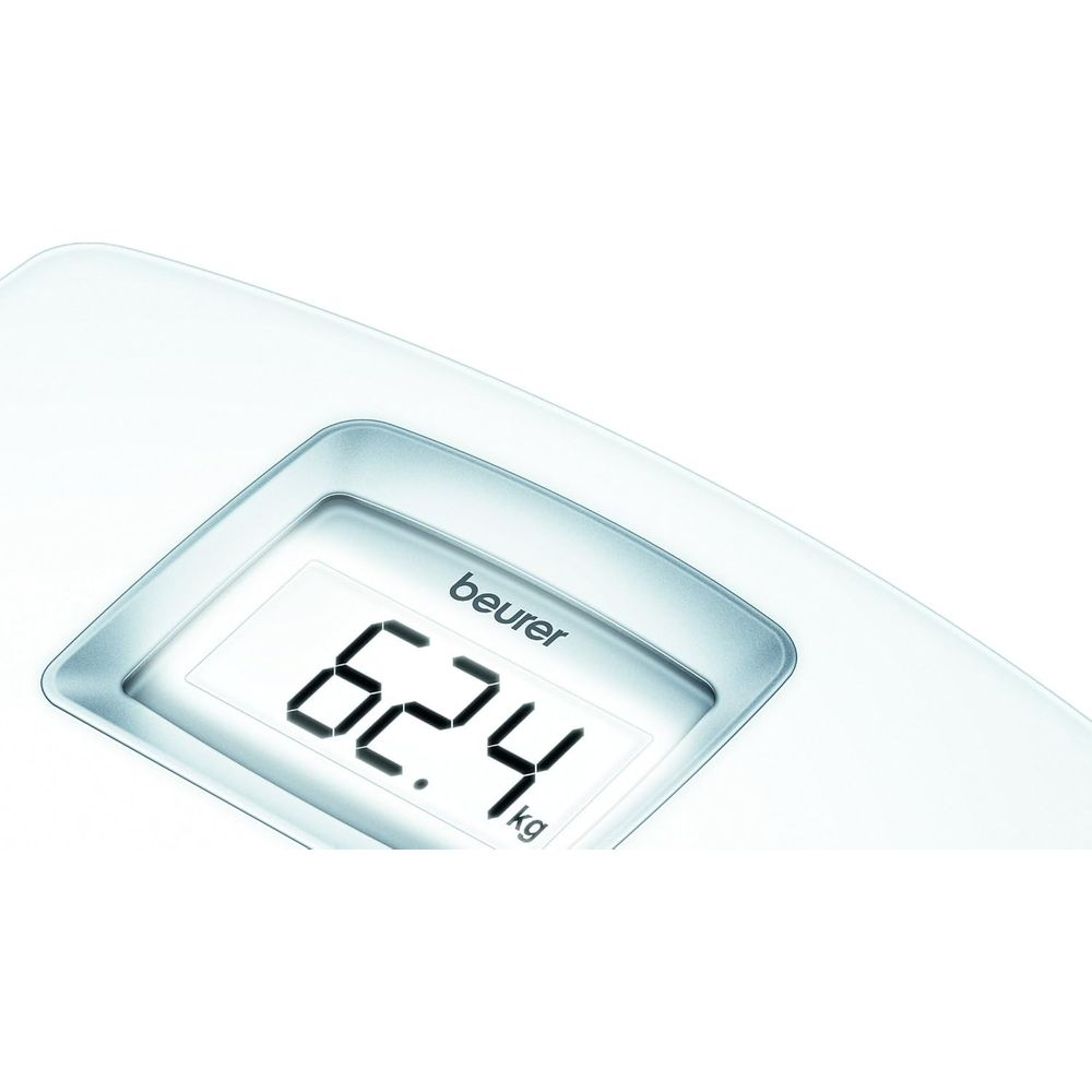 Balance numérique affiche 62,4 kg.