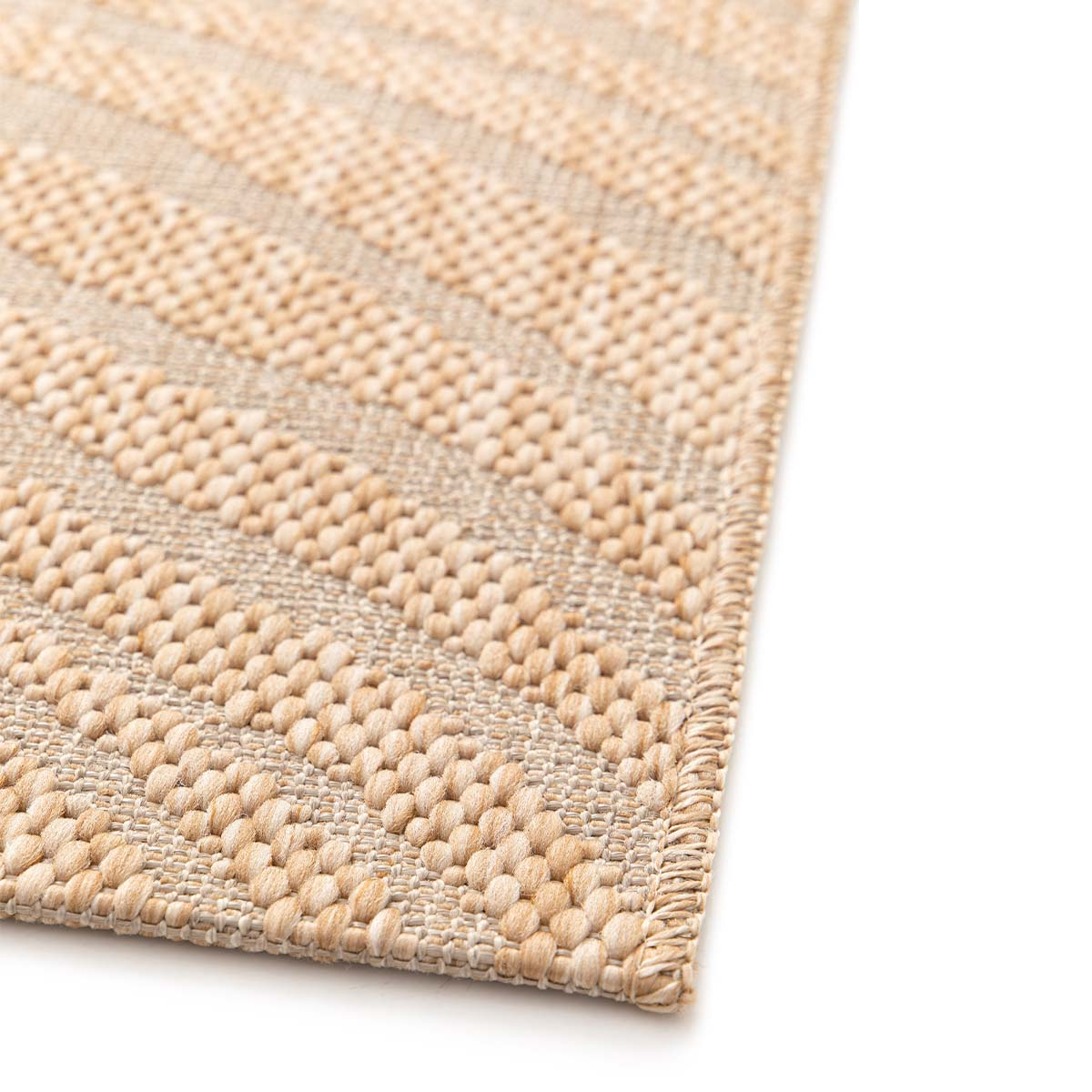 Een beige vloerkleed met een geometrisch patroon van strepen en cirkels.
