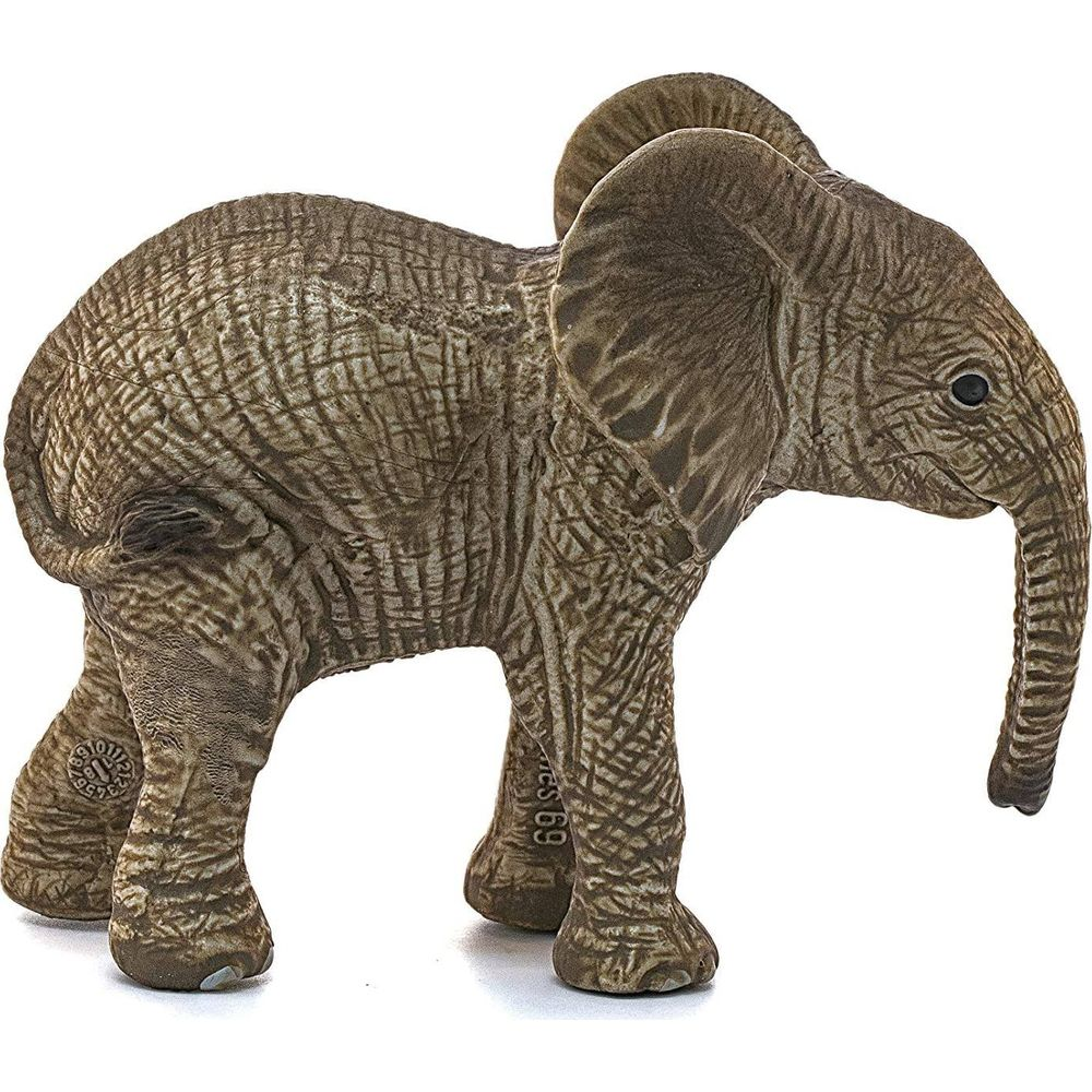 Una piccola statuetta di elefante grigio su sfondo bianco.