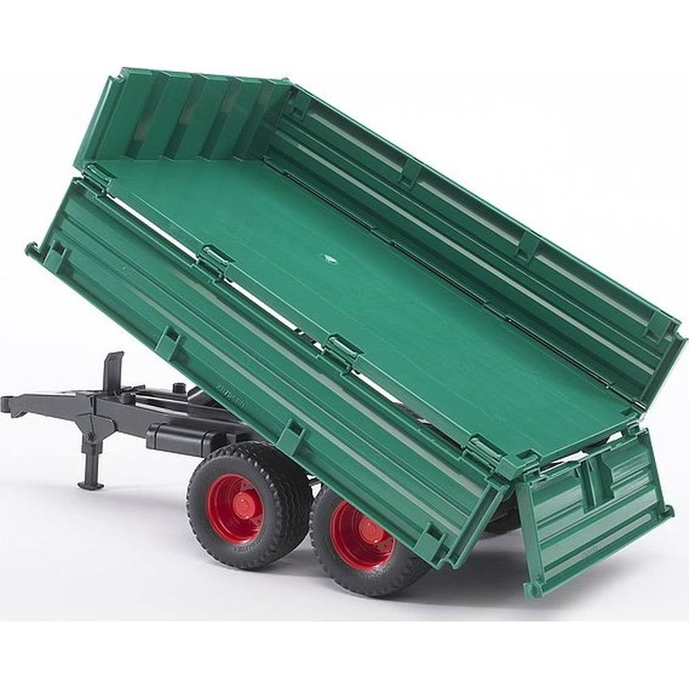 Grüner Kipperanhänger mit schwarzem Fahrgestell und roten Felgen.