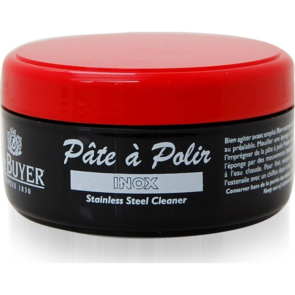 Schwarzer Behälter mit rotem Deckel, "Pâte à Polir INOX Stainless Steel Cleaner" Aufschrift.