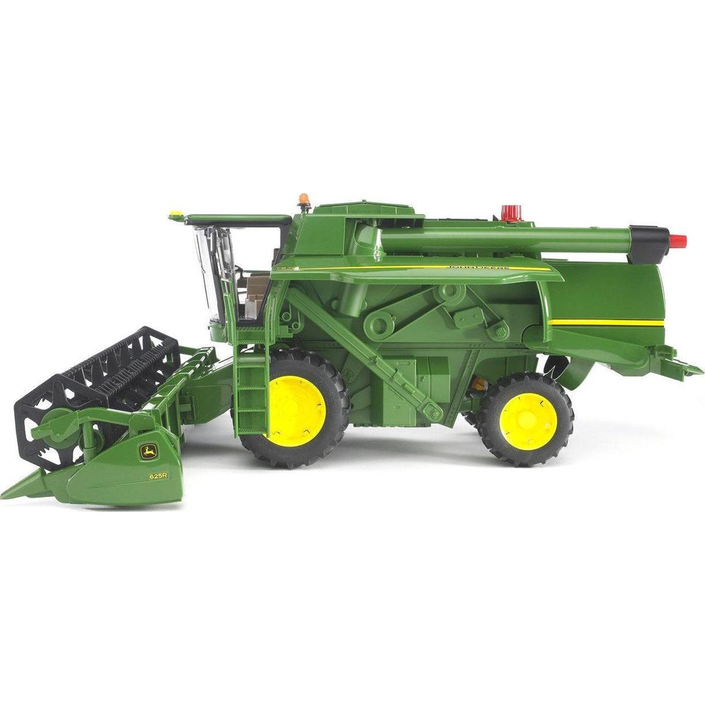 Zielona kombajn John Deere z żółtymi kołami i nagłownica.