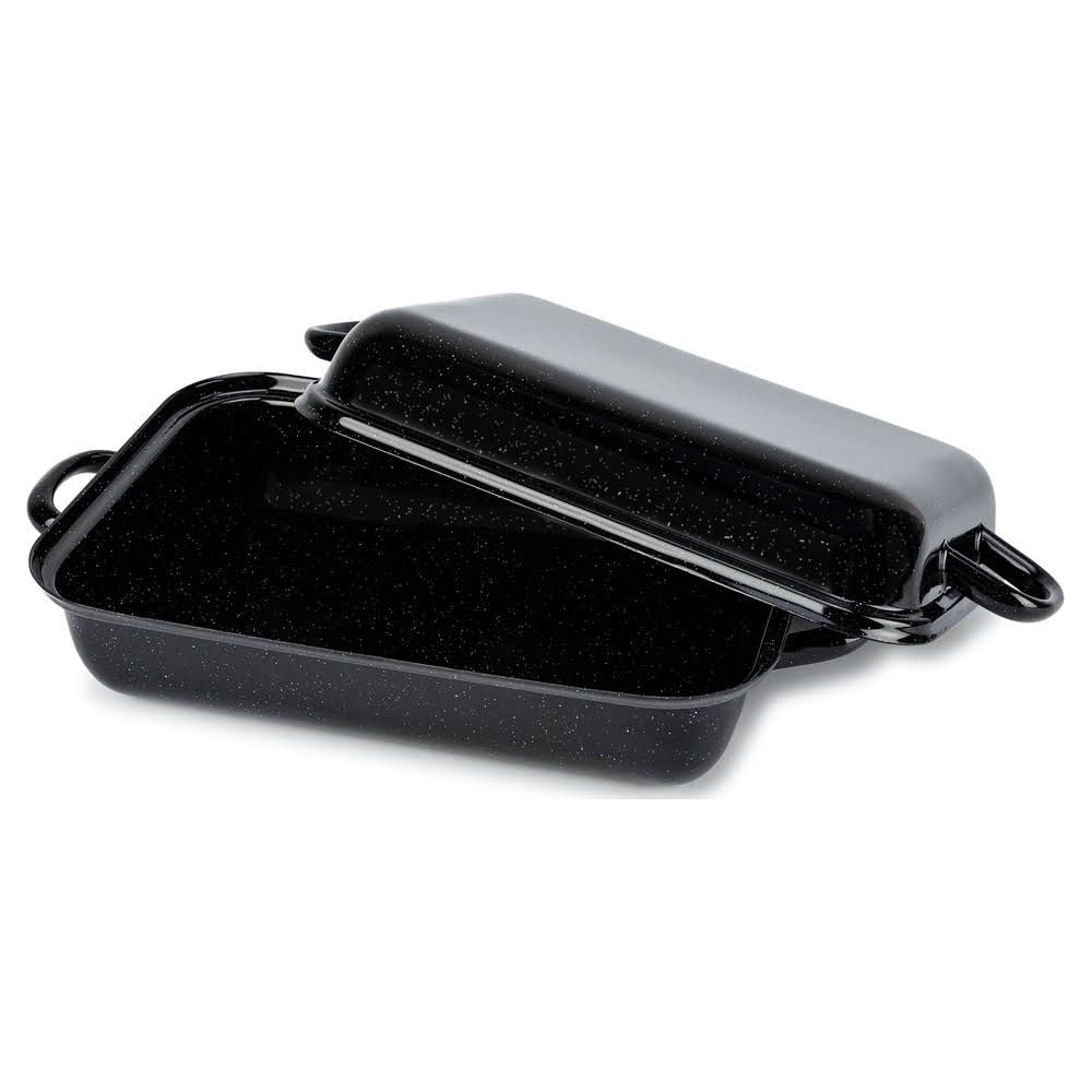 Un plat à rôtir noir émaillé avec des mouchetures blanches et des poignées.
