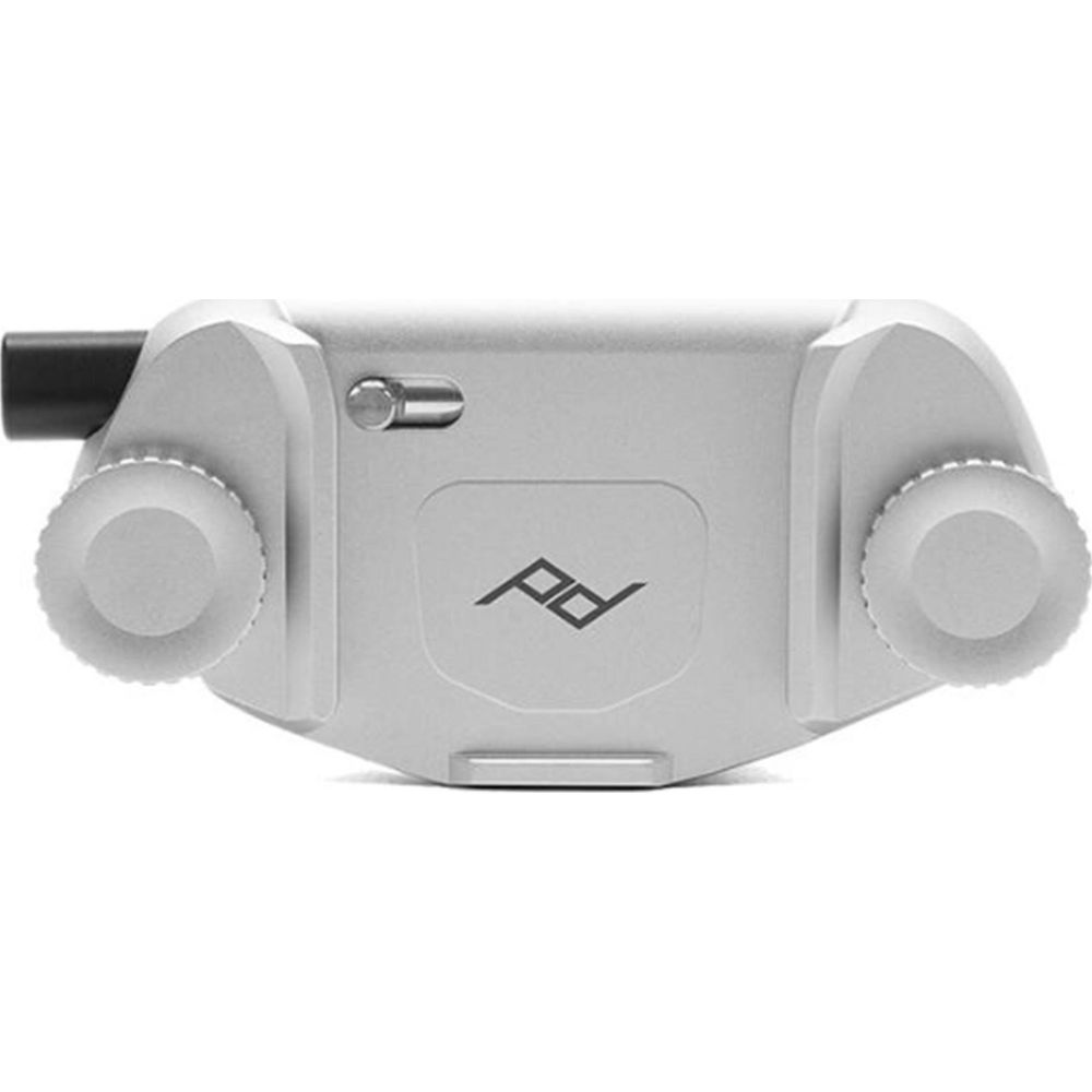 Srebrny uchwyt do aparatu z dwoma pokrętłami i czarnym bolcem.