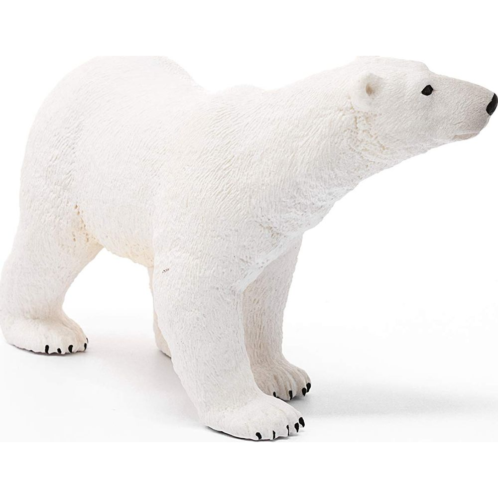 Biały plastikowy niedźwiedź polarny stoi na białym tle.