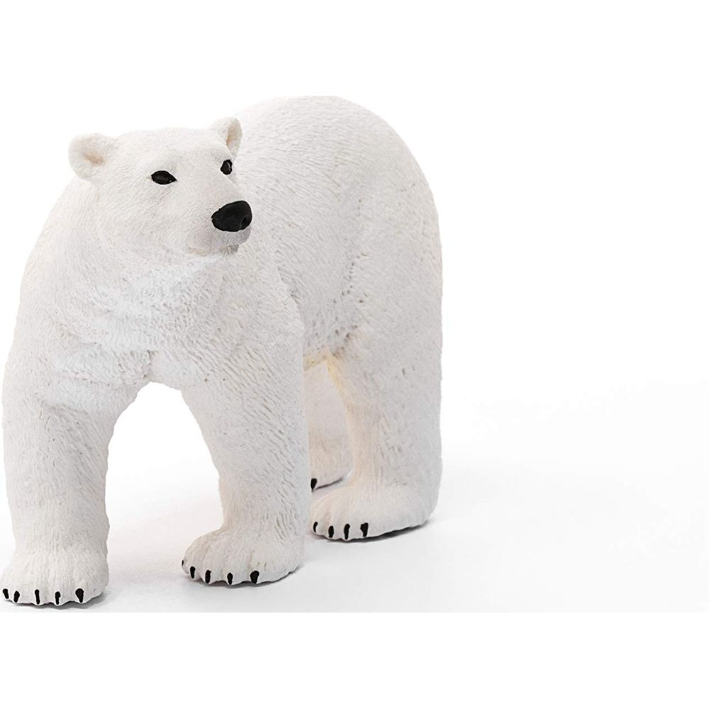 Biały plastikowy niedźwiedź polarny stoi na białym tle.