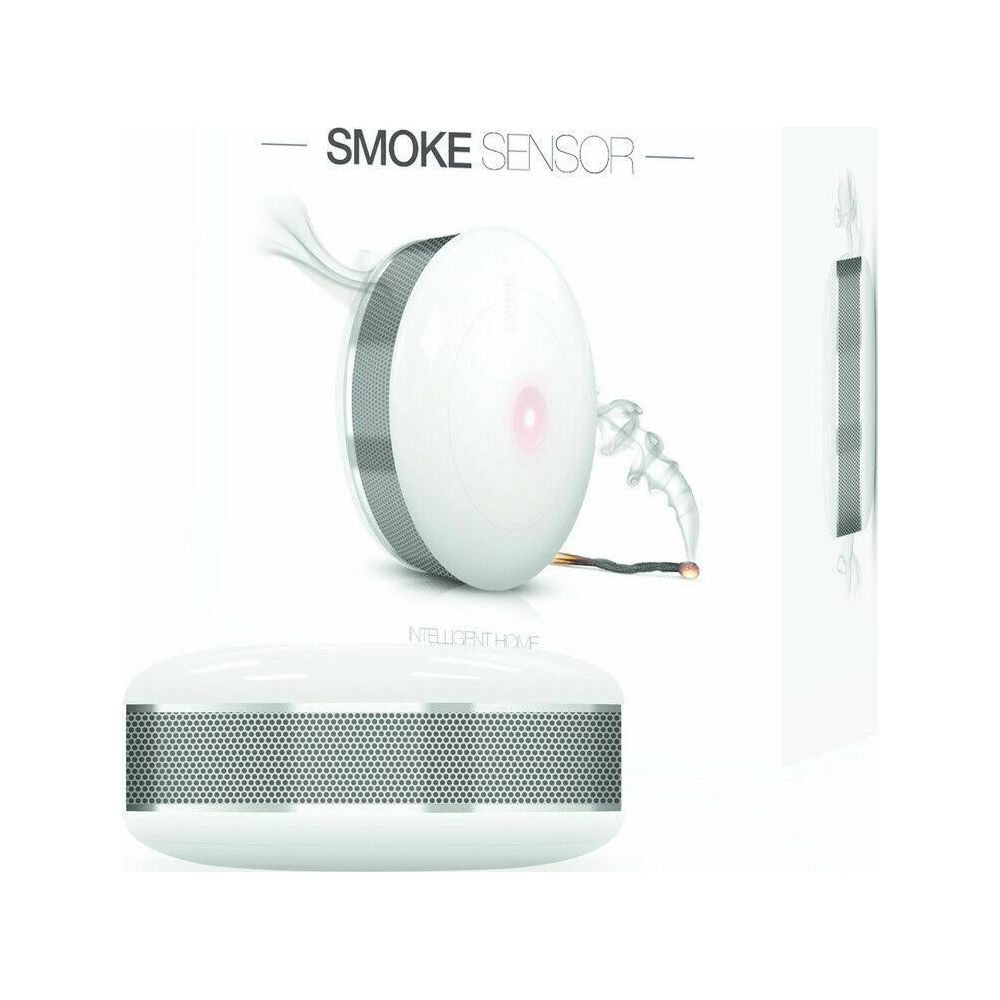 Biały czujnik dymu z czerwonym światłem, wykrywa dym ze zapalonej zapałki.