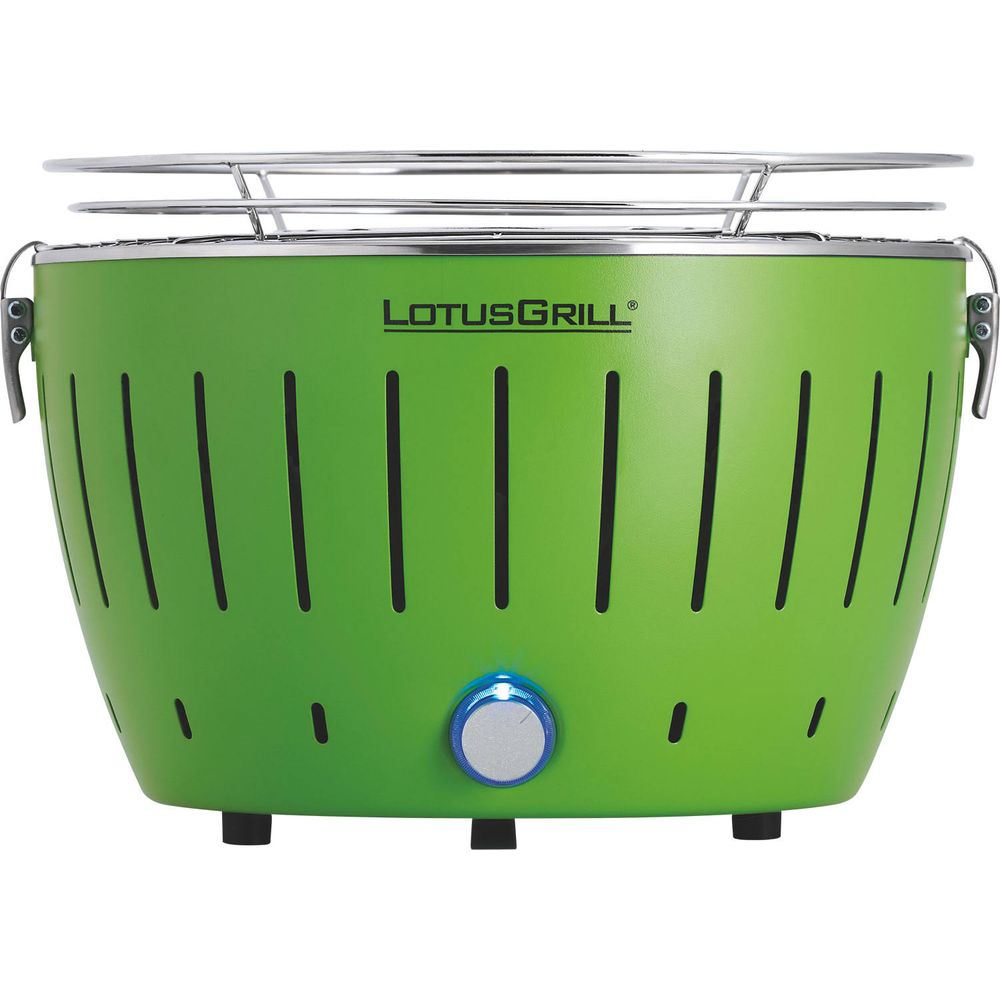 Zielony grill Lotus z srebrnym rusztem i niebieskim pokrętłem.