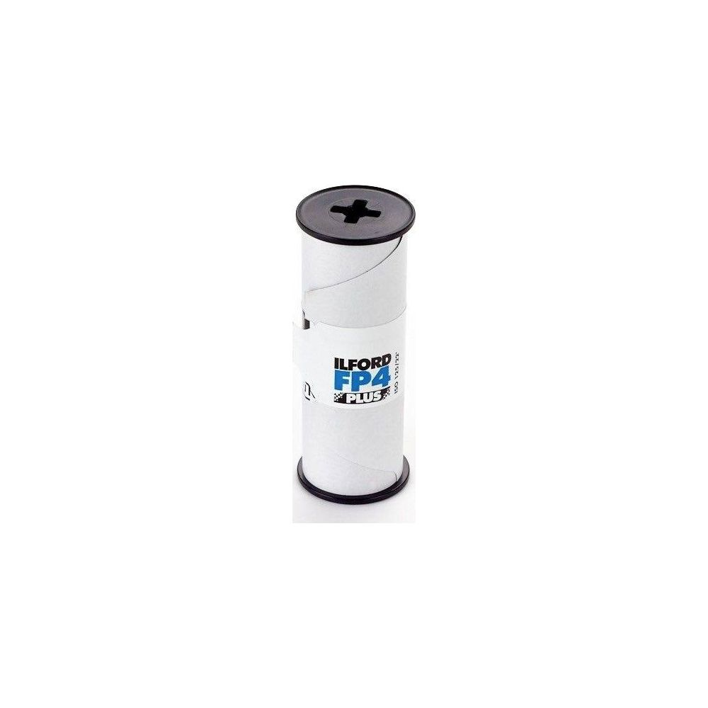 Un rollo de película Ilford FP4 Plus con tapa negra y símbolo de cruz.