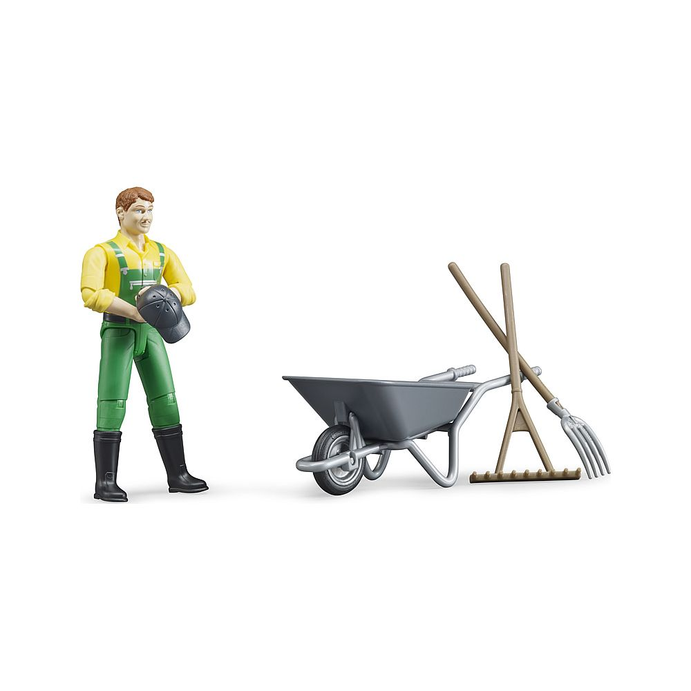 Zabawkowy rolnik z konewką i narzędziami.