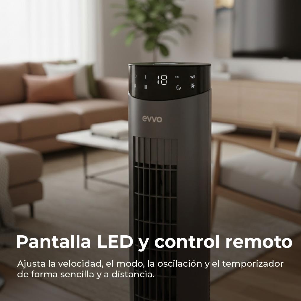 Un ventilador de torre gris y elegante está en un salón, frente a un sofá.
