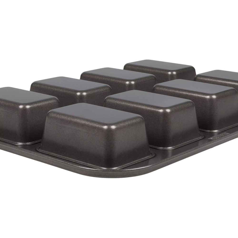 Dunkelgraue Backform für Mini-Loaf-Kuchen mit acht rechteckigen Vertiefungen.