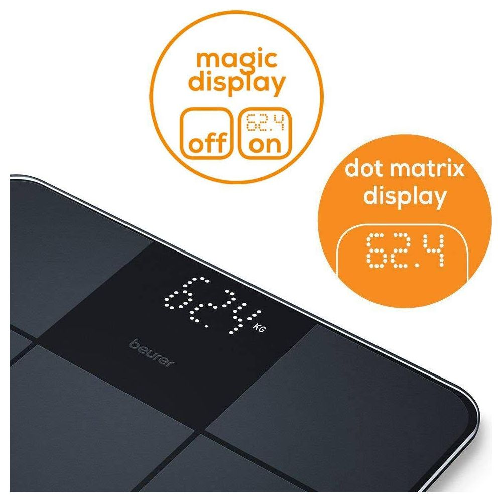 Bilancia digitale nera che mostra 62,4 kg con indicatori.