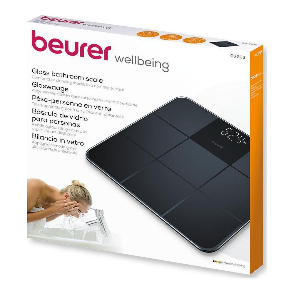 Confezione di una bilancia digitale in vetro con una donna che si lava il viso.