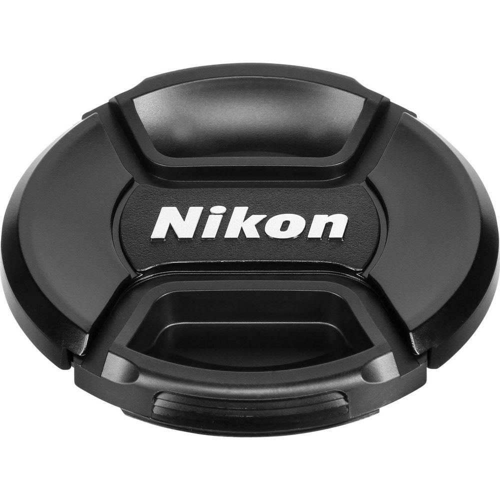 Bouchon d'objectif noir avec logo Nikon blanc. Conception centrale avec poignées.
