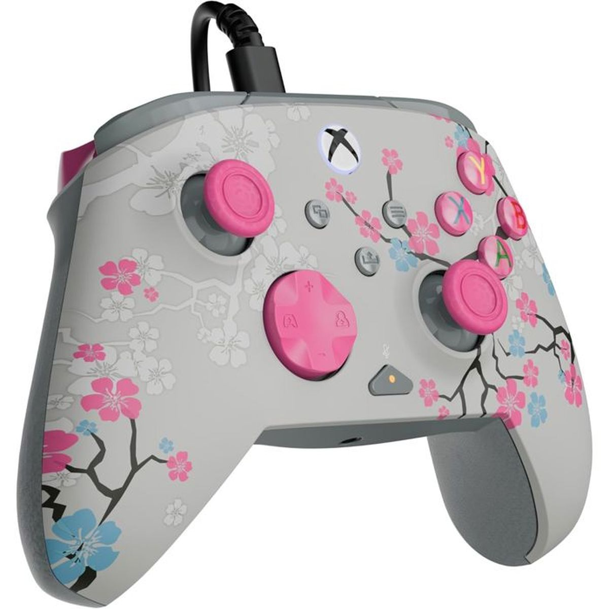 Ein grauer Controller mit rosa und blauen Kirschblütenmuster.