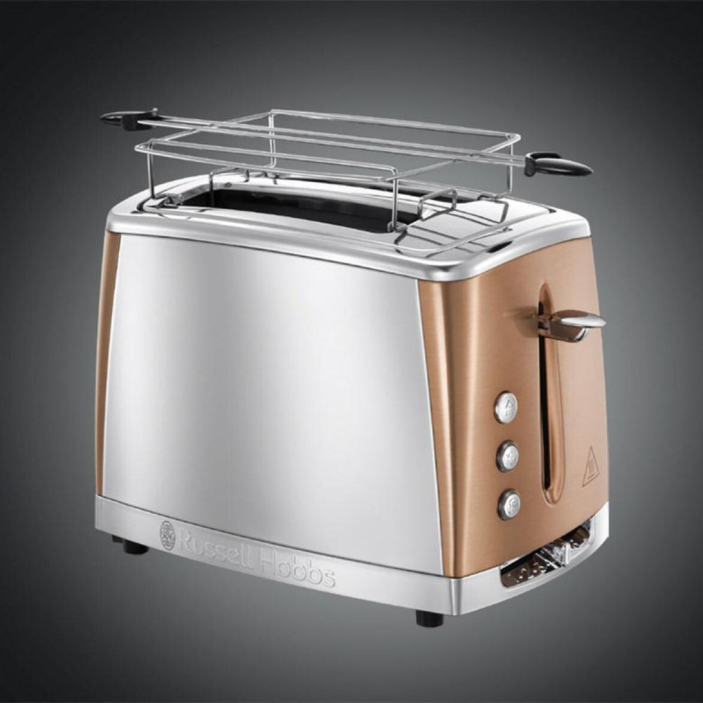 Ein silberner Toaster mit Kupferakzenten und einem Brötchenrost.