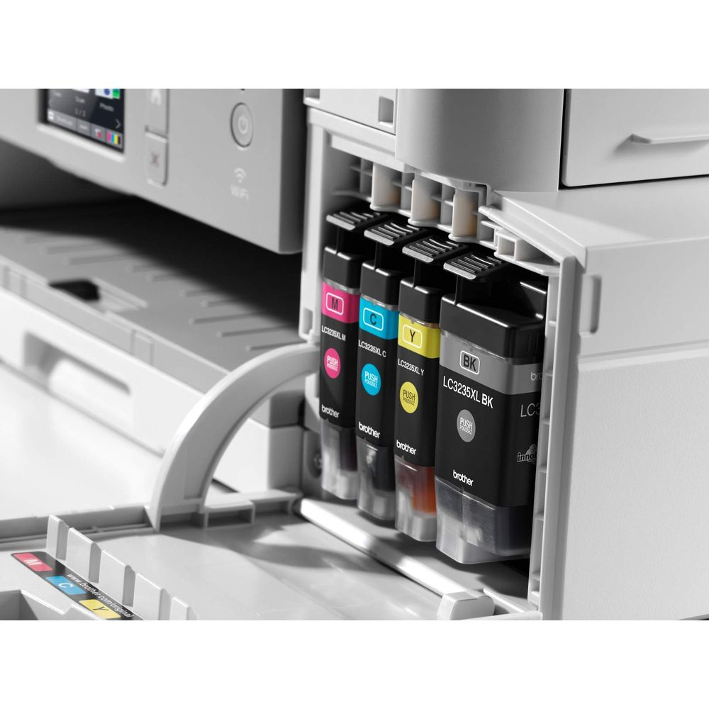 Drukarka atramentowa z czterema wkładami: magenta, cyjan, żółty i czarny.