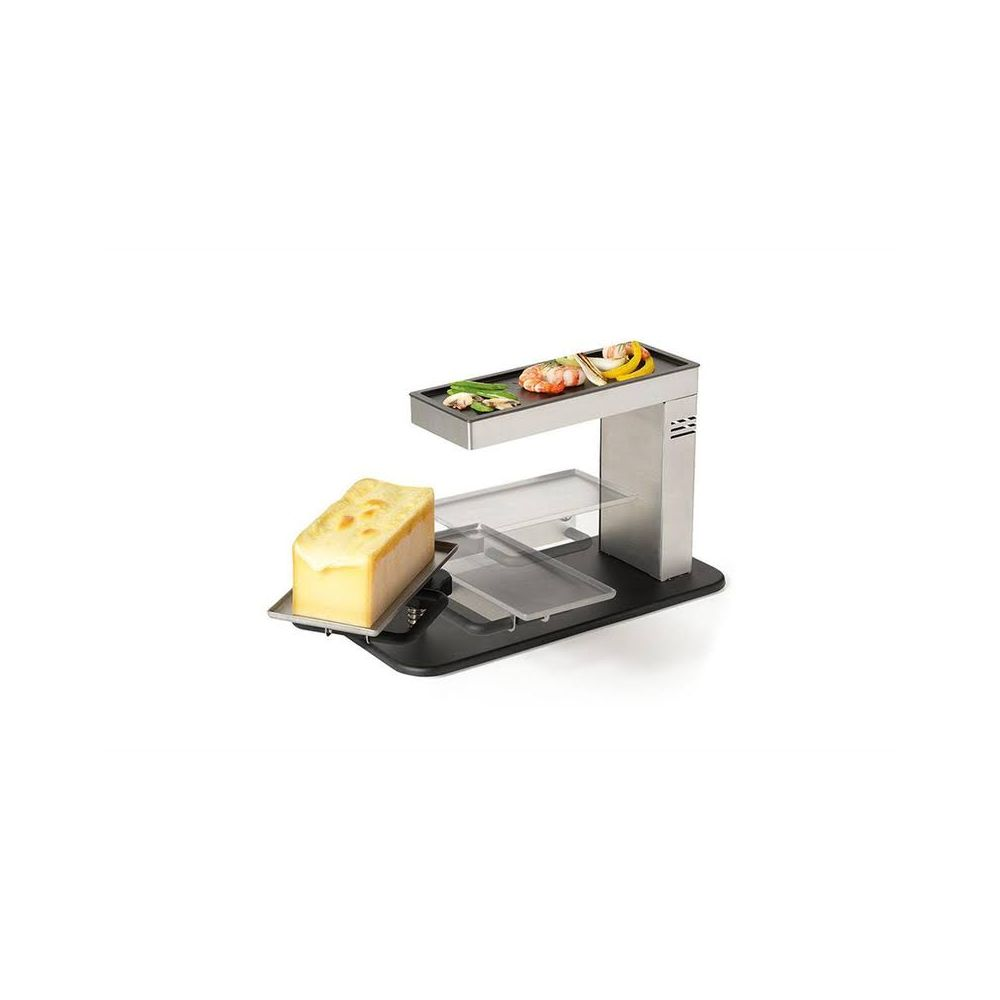Grill per raclette con formaggio e carne/verdure sulla piastra superiore.
