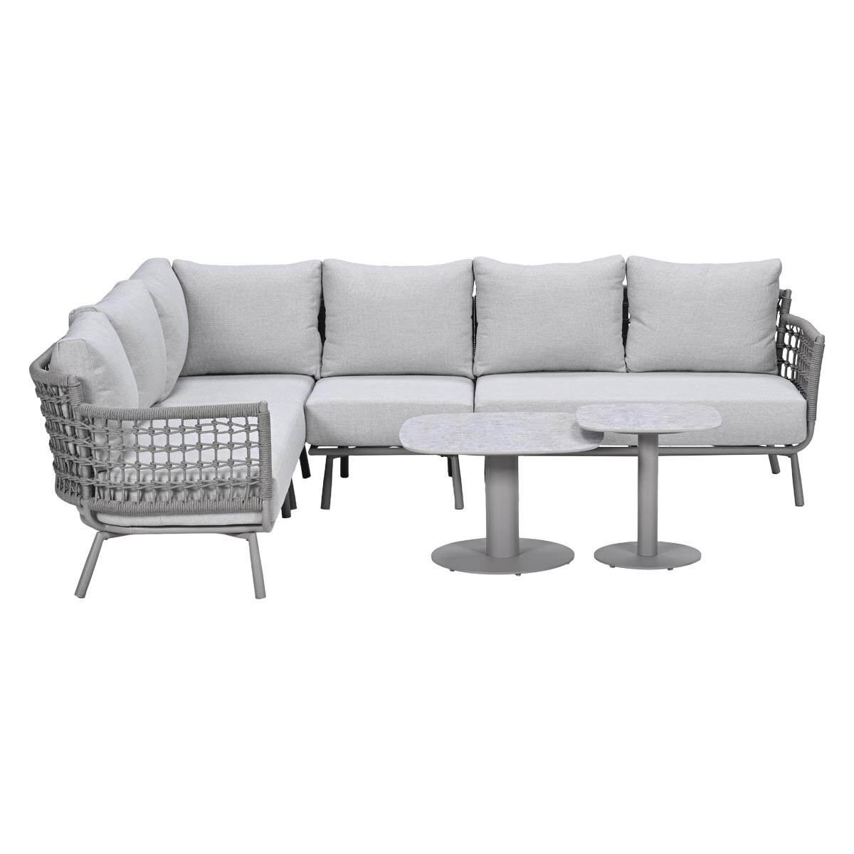 Gray sectional sofa with cushions and two round side tables.
