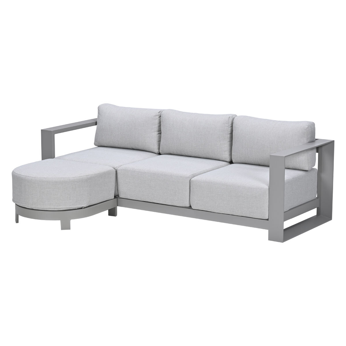 Grijze modulaire bank met chaise longue en kussens.