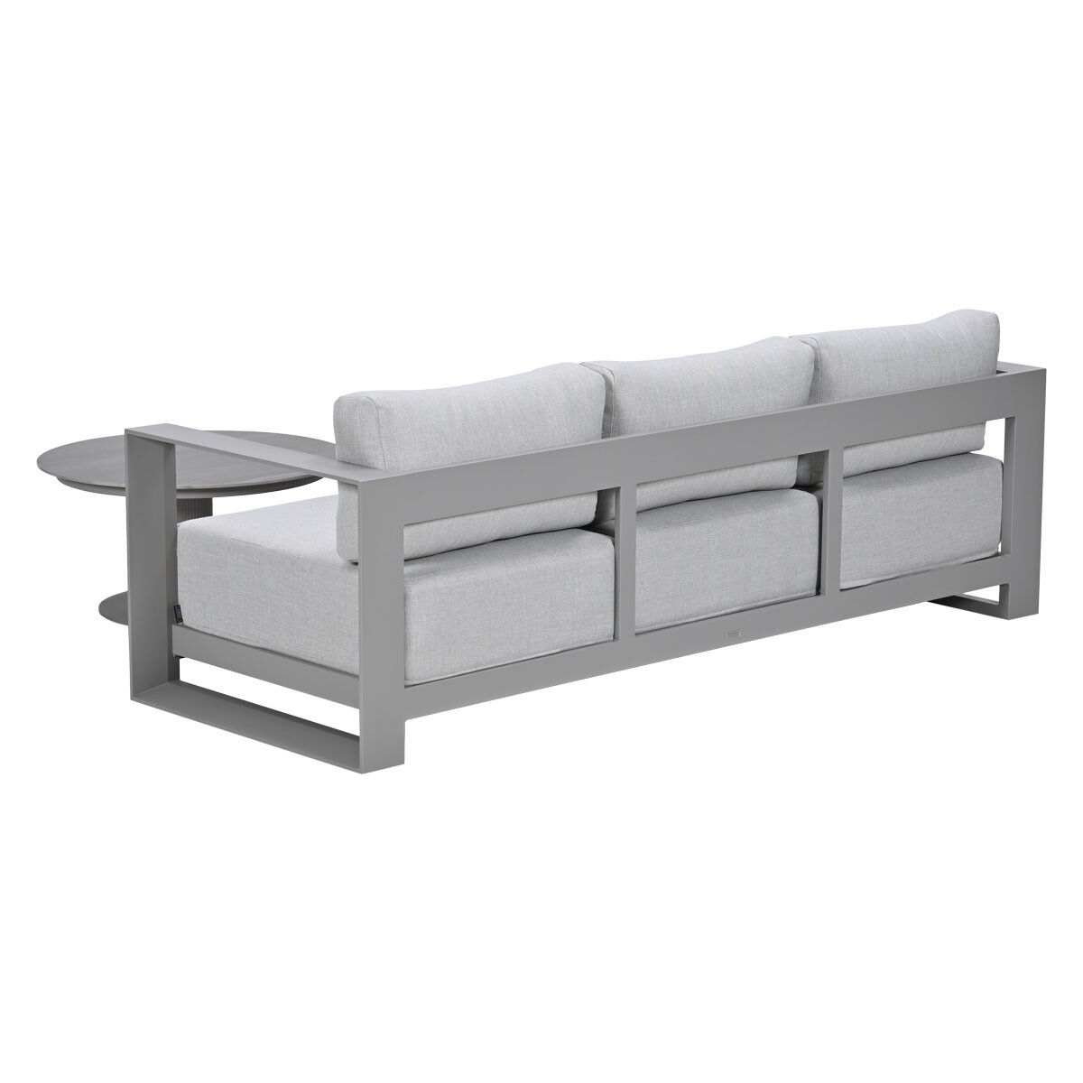 Grey sofa with light grey cushions and a round side table.