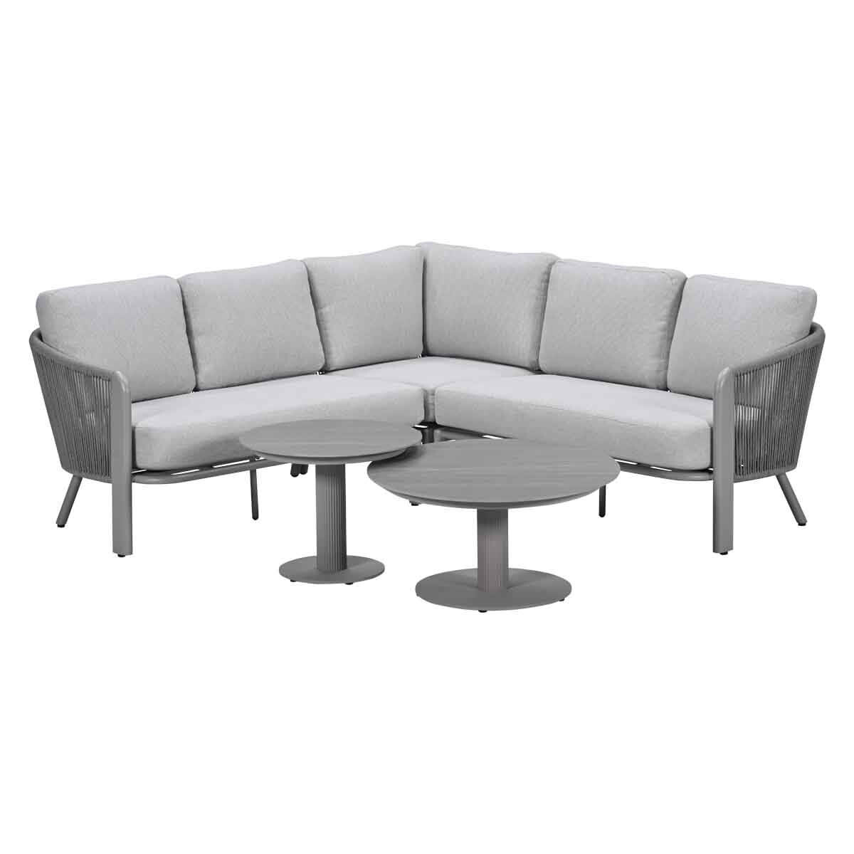 Gray sectional sofa with two round coffee tables.