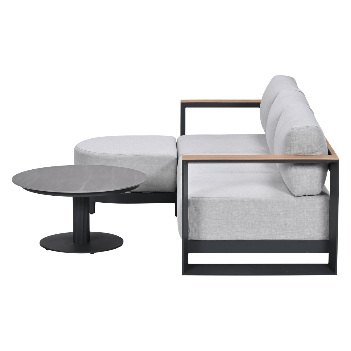 Gray sectional sofa with black frame and wood accents, next to a round gray table.