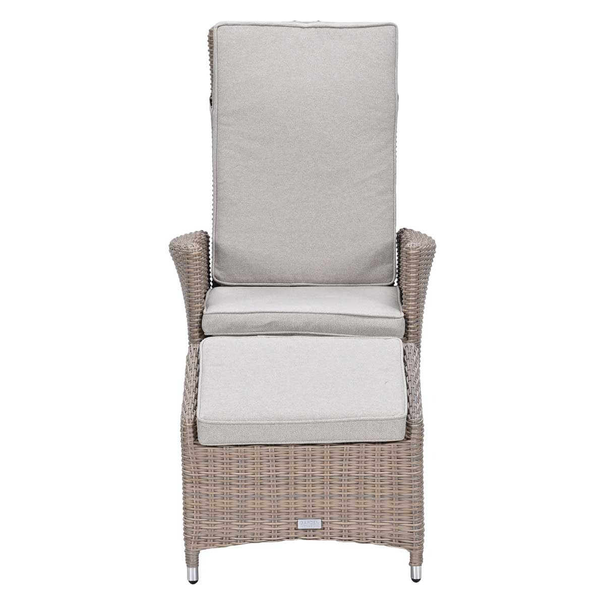 A grey wicker chair with an ottoman and light grey cushions.