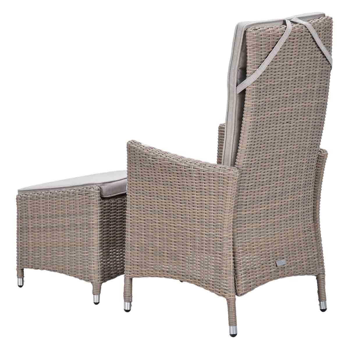 Brown rattan armchair with high back and matching ottoman, white cushions.
