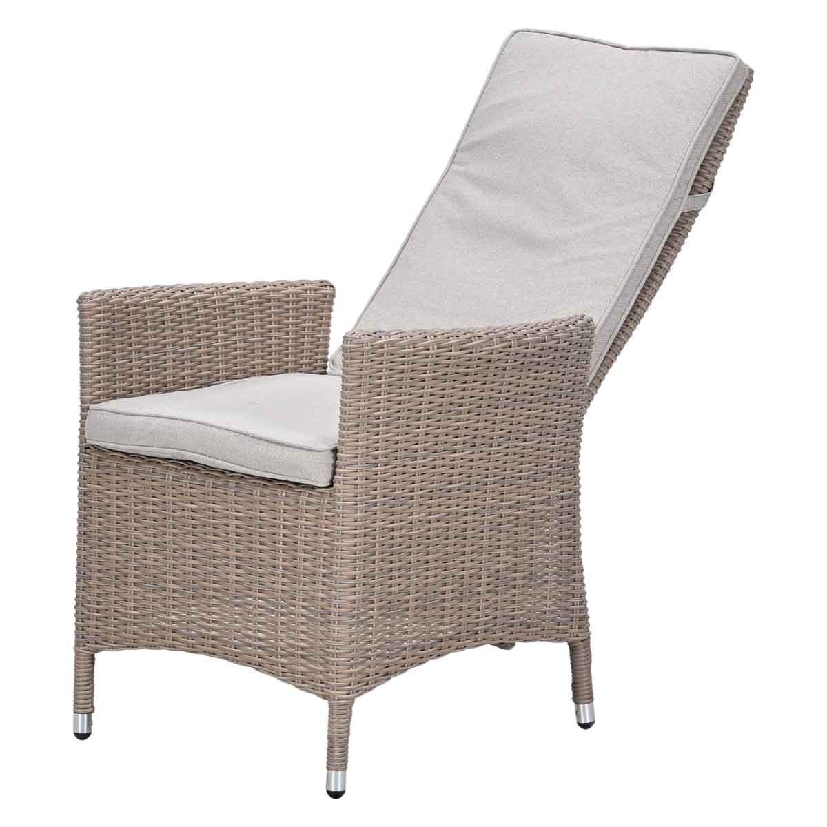 A light rattan armchair with cream cushions and an adjustable backrest.