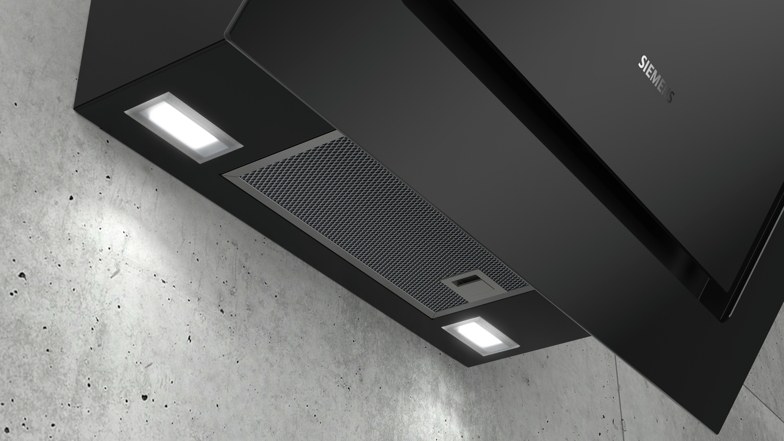 Schwarze Dunstabzugshaube mit Lichtern über Betonwand.