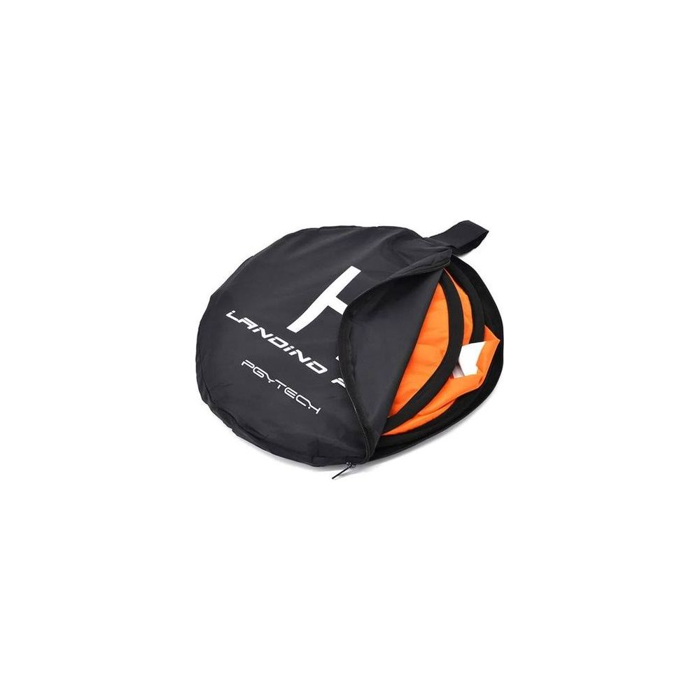 Bolsa negra con alfombrilla de aterrizaje de dron naranja, parcialmente abierta.