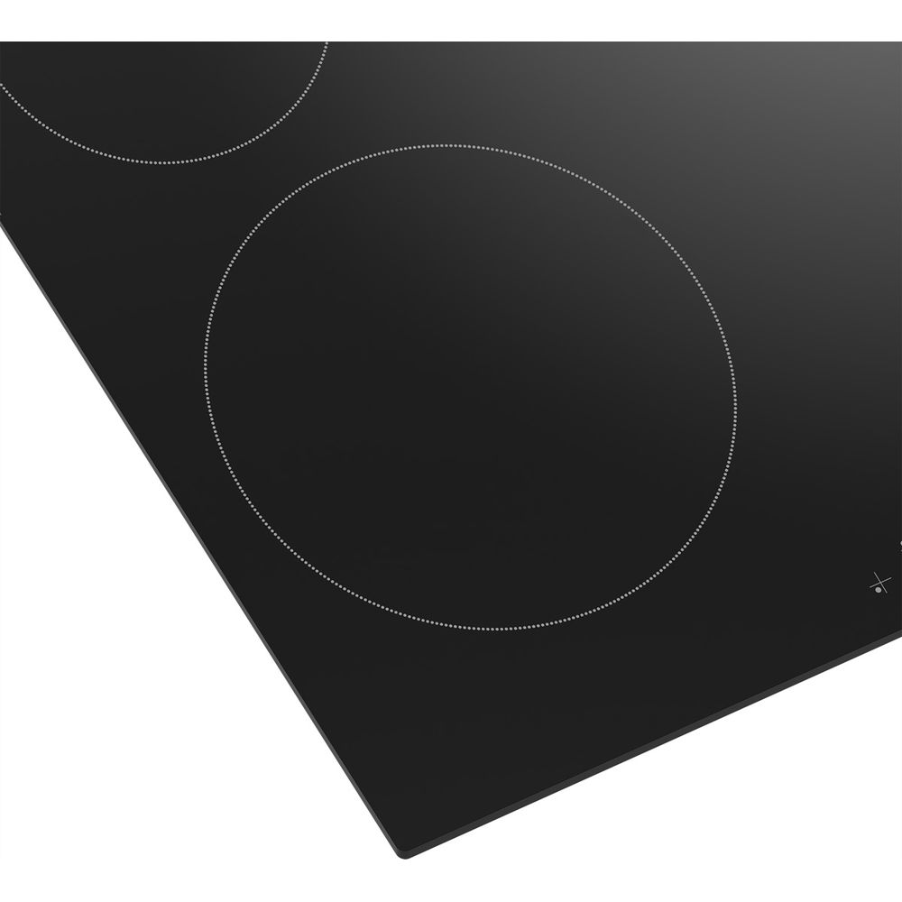Primo piano di un piano cottura in vetroceramica nero con due zone cottura.